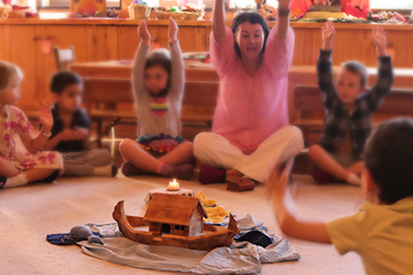 Morning circle, Kindergarten Teacher doing movement activities with children.